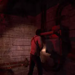 Nathan Drake w mrocznym pomieszczeniu, kontynuuje swoją uncharted pogoń za fortuną, badając mechanizm.