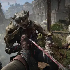Krwawa walka z potworem w stylu Dark Messiah of Might & Magic. Gracz walczy mieczem z przerażającym stworzeniem na tle zrujnowanej twierdzy.