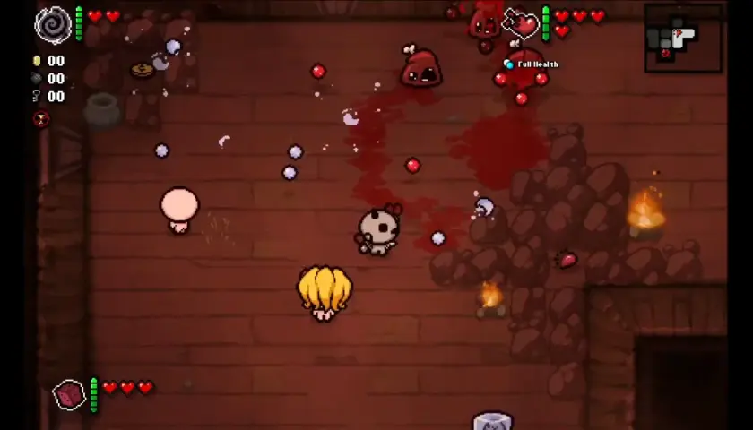 Dwie postacie w grze The Binding of Isaac walczą z potworami. Tryb co-op pozwala na wspólną zabawę.