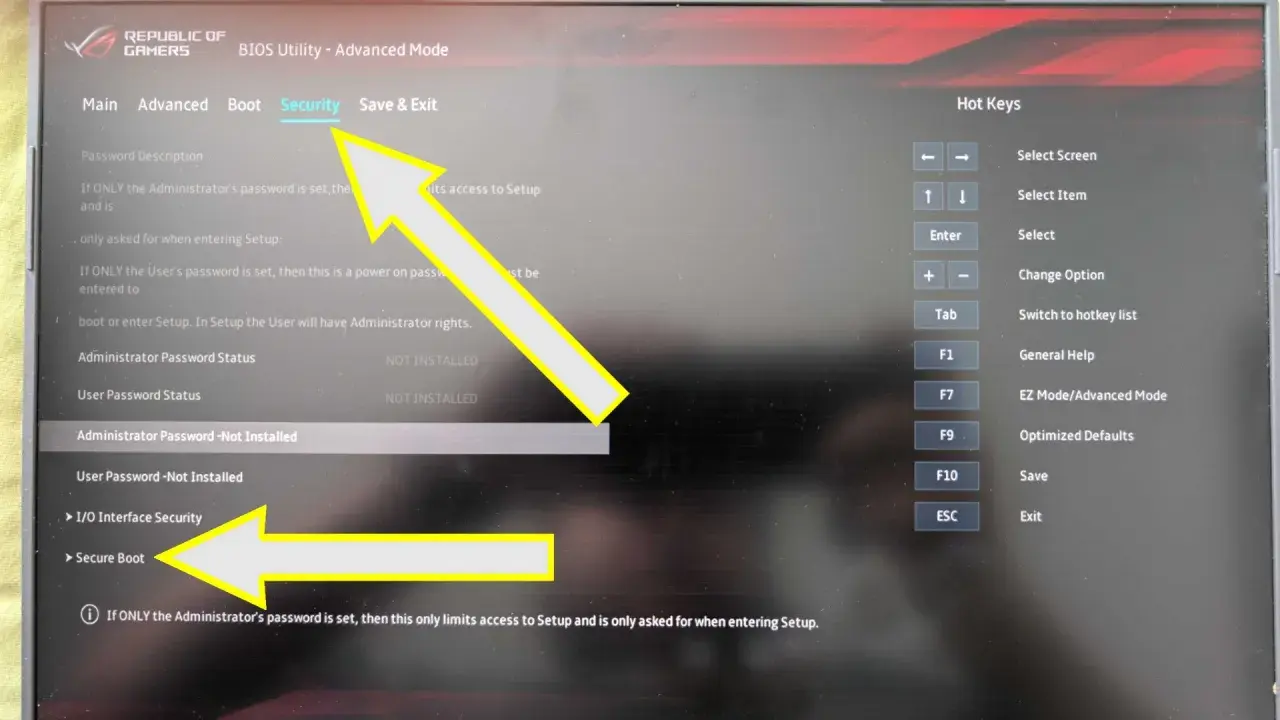 Menu BIOS z opcją "Secure Boot" zaznaczoną strzałką. Ustawienia bezpieczeństwa systemu.
