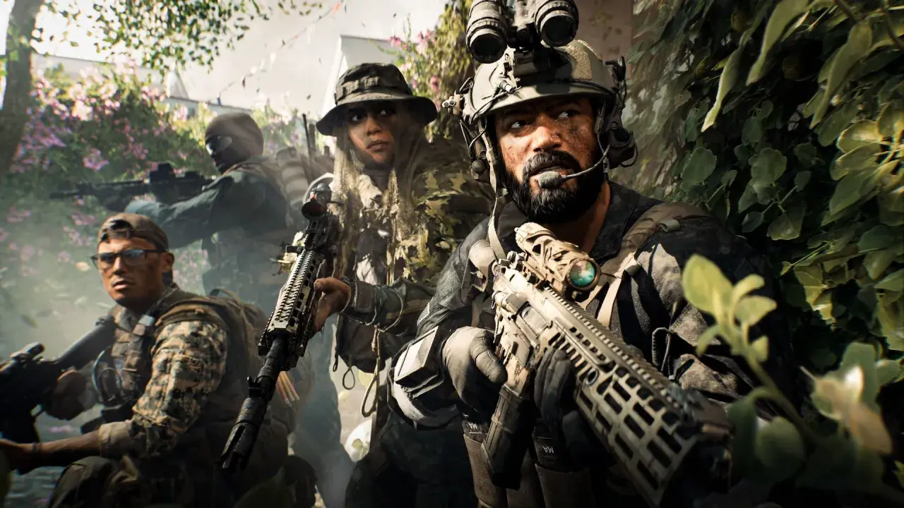 Żołnierze w kamuflażu, gotowi do akcji w kampanii Battlefield 6. W tle kwitnące krzewy i zieleń.