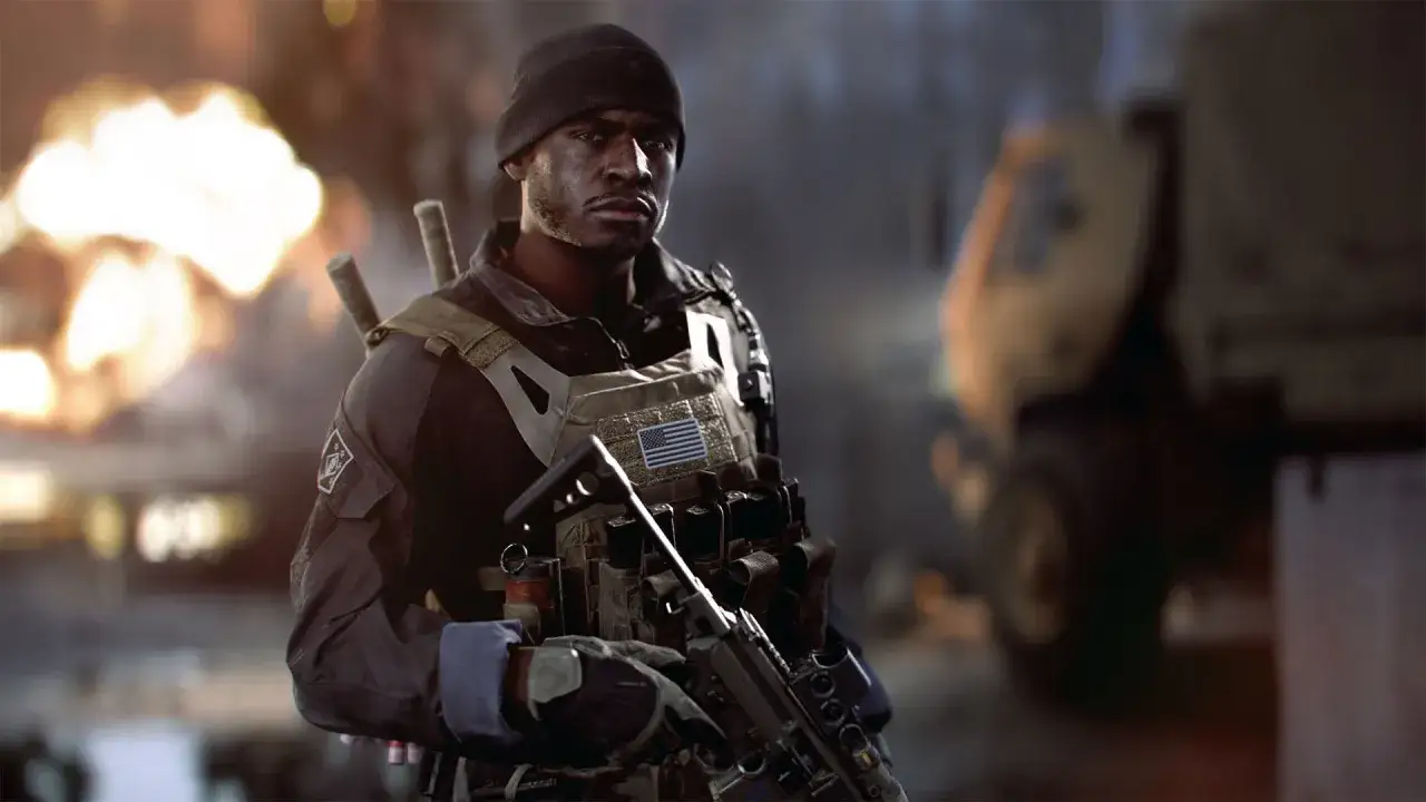 Żołnierz w taktycznym wyposażeniu, z karabinem w ręku, na tle wybuchów. To scena z kampanii Battlefield 6.